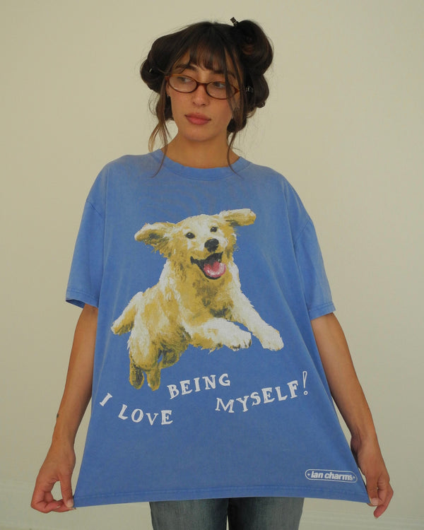 Woman in glasses wearing an oversized blue tee with a golden retriever and I LOVE BEING MYSELF text – always be my bailey tee