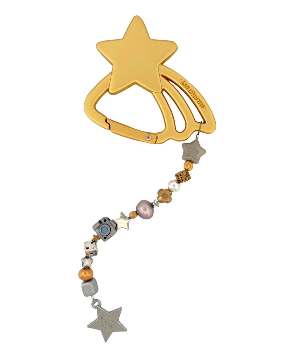 Full view of the good as gold keychain: gold star carabiner with gold and silver beads and a silver star charm