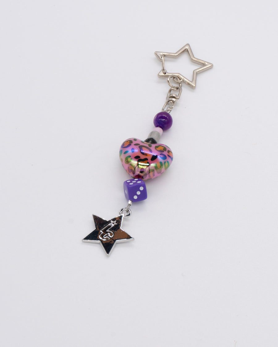 Purple glitter heart, dice and black star bead charm on a silver star clasp – barneys favorite charm by Ian Charms