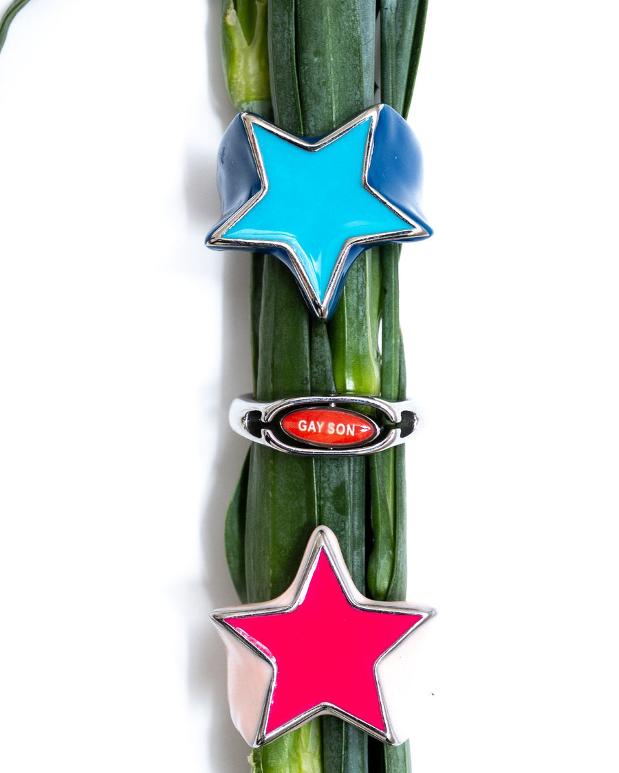 Red pill or blue pill ring stacked with star rings on green flower stems
