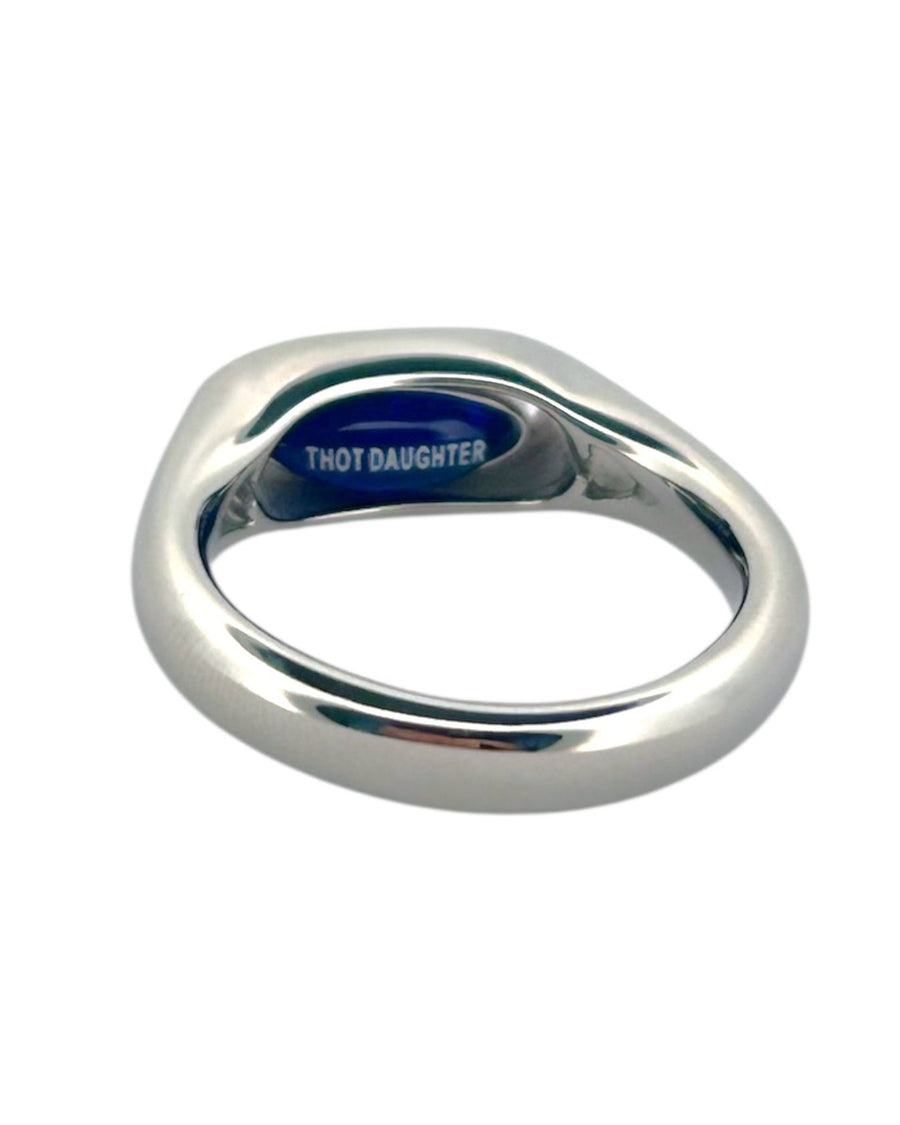 Angled view of the silver red pill or blue pill ring showing the blue THOT DAUGHTER side