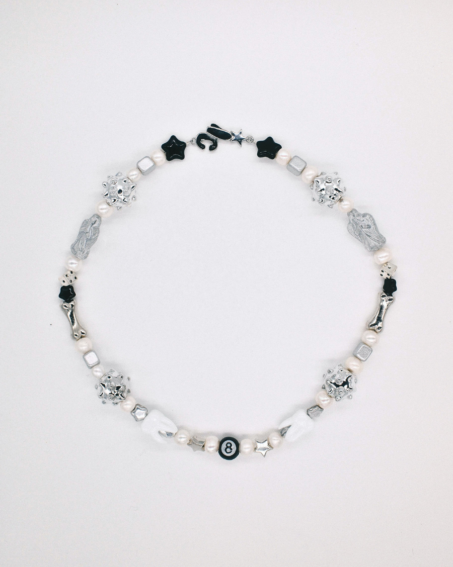 Silver, white and black beaded necklace with spiky silver beads, black stars and an 8-ball – the sloane necklace