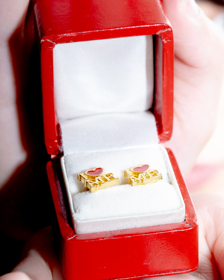 Pair of gold I heart ME stud earrings in a red ring box – the no notes studs by Ian Charms