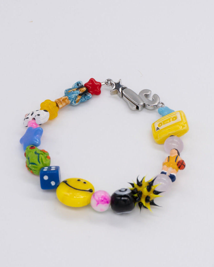 Multicolor beaded bracelet with dice, star, smiley and glass beads and a silver clasp – the perfect bracelet does not exi..