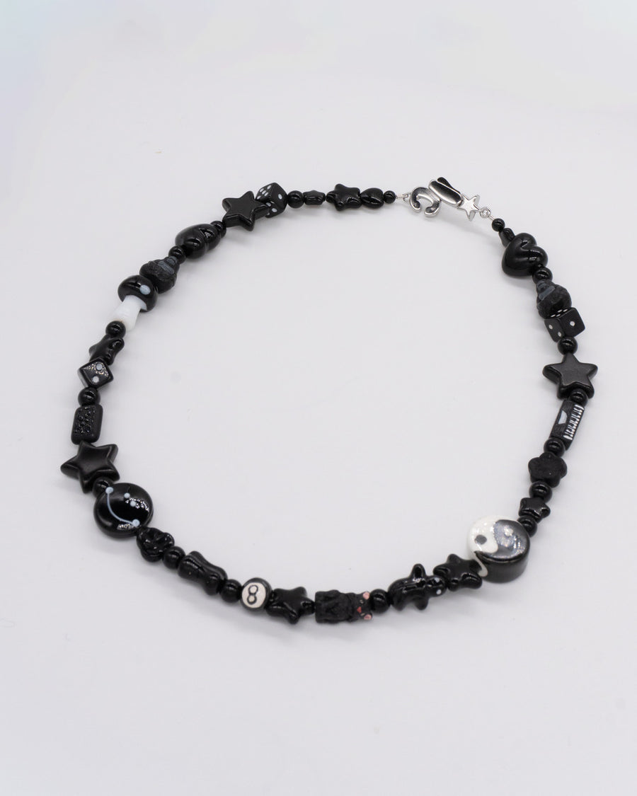 All-black beaded necklace with star, heart, yin-yang and skull beads – the smoker necklace by Ian Charms